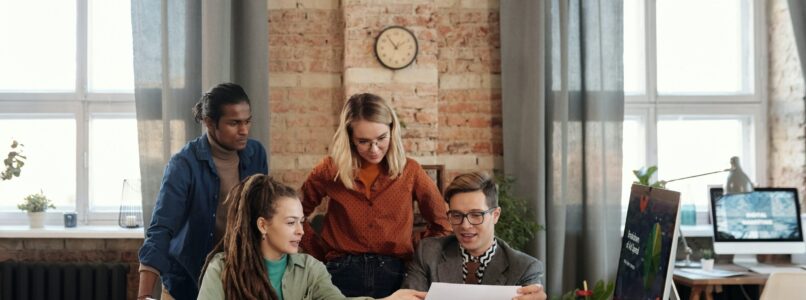 four employees at desk
